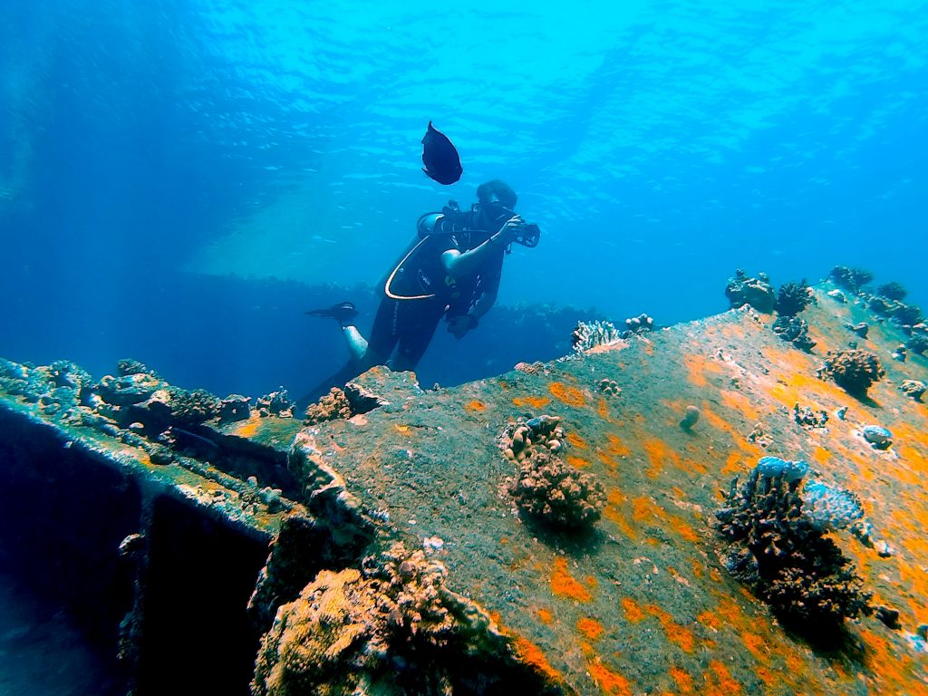 Deep Sea Divers exploring the Depths or the ocean